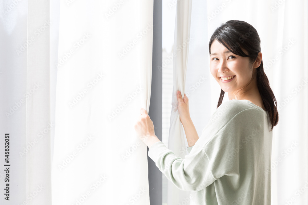 attractive asian woman bathing in the sunlight attractive asian woman bathing in the sunlight