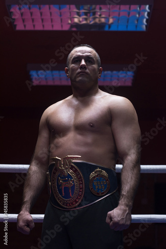 kick boxer with his championship belt © .shock