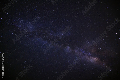 Fototapeta Naklejka Na Ścianę i Meble -  Milky way galaxy with stars and space dust in the universe, Long exposure photograph, with grain.