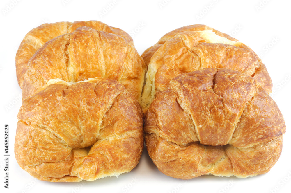 fresh baked croissant isolated on white background