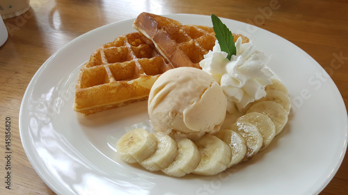 Banana and vanilla ice cream with waffle