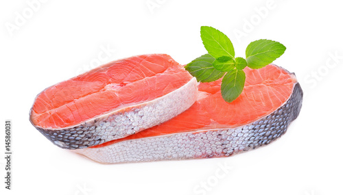 Raw fresh salmon and mint leaves on a white background