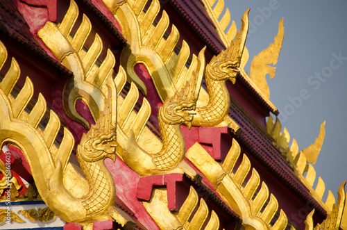 Beautiful Nagas or Serpents (Giant snake) statue on the top of roof in 