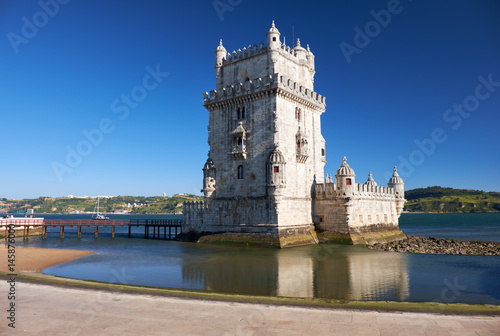 Belem Tower on river Tagus in Lisbon with reflection in water on blue sky background  Portugal