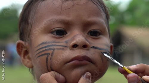 Painting a Face of Native Brazilian Children (Indio) - Brazil