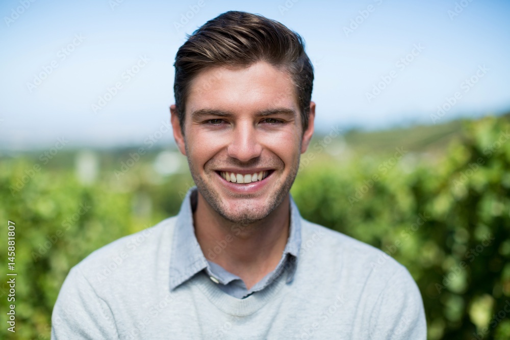 Portrait of smiling young man at vineyard Portrait of smiling young man at vineyard