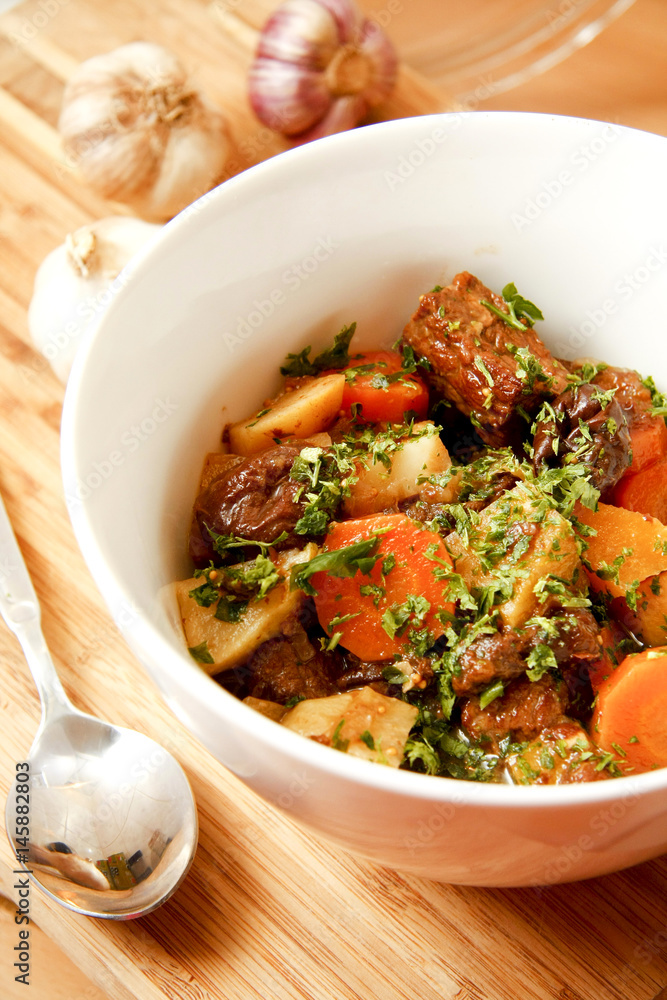 Salad of carrot and garlic potatoes in white bowl Salad of carrot and garlic potatoes in white bowl