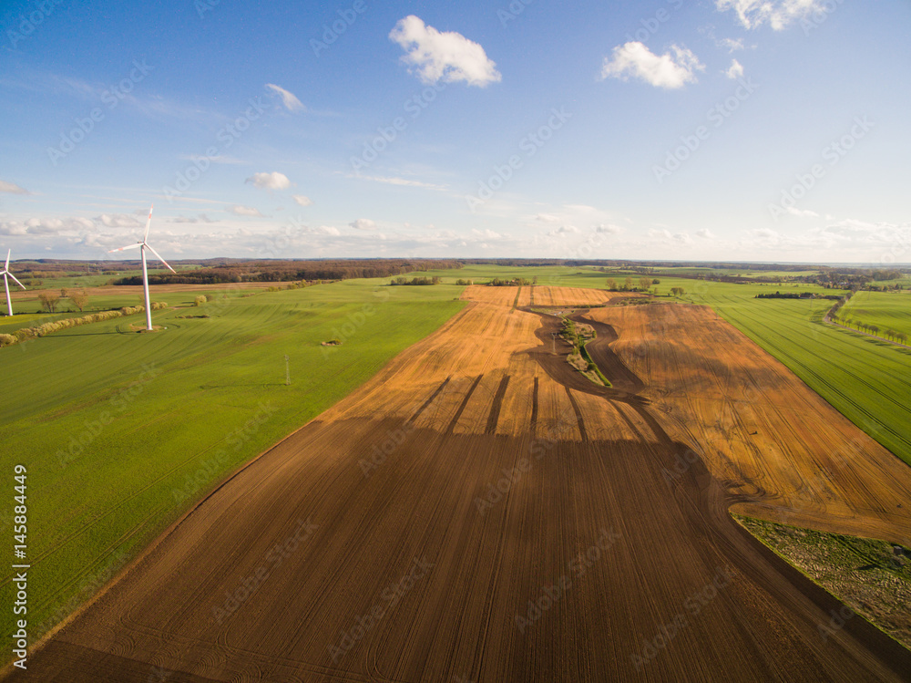 Aerial view of beautiful agricultural fields in spring under blue sky - germany