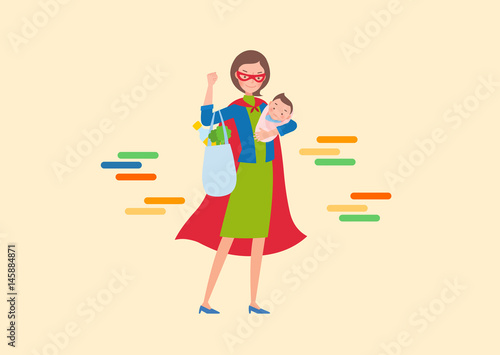 The superwoman is holding a baby and a grocery bag.
