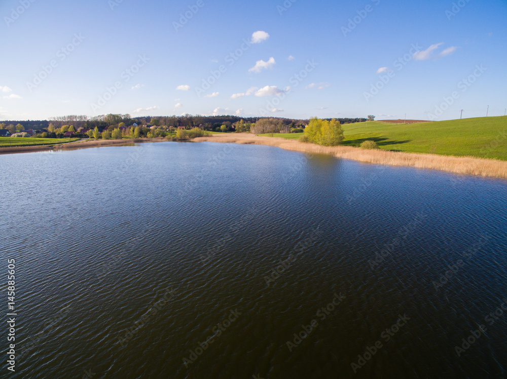 aerial view of a beautiful blue lake under blue sky - germany