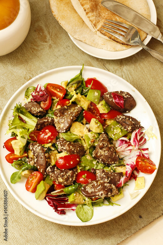 Salad beef steak with lettuce and tomatoes