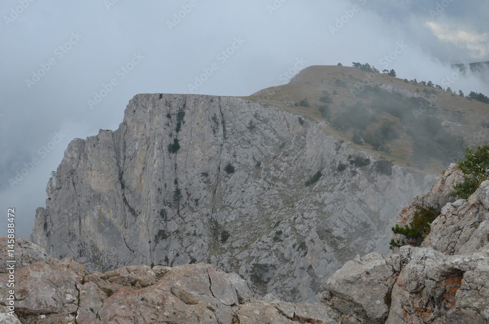Fototapeta premium Fog over the rocks of Ai Petri