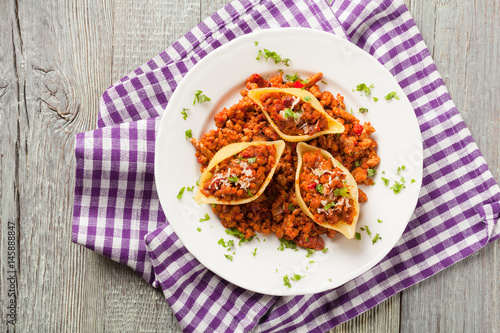 Italian pasta Conchiglioni Rigati stuffed with dry tomatoes and meat.