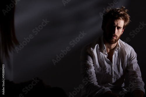 Depressed man sitting alone
