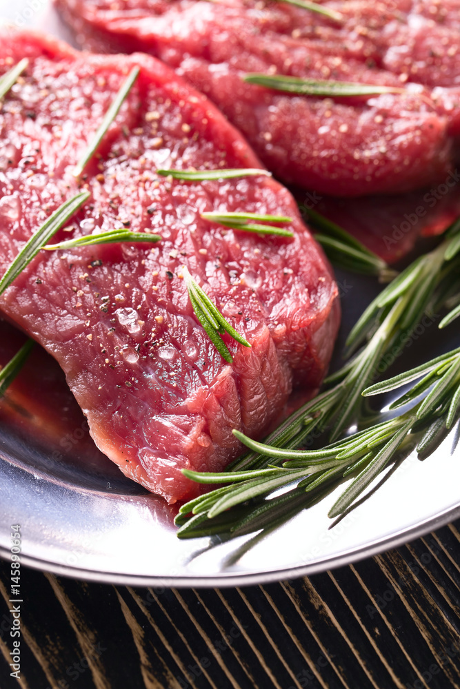 Beef steak with rosemary , salt and pepper.