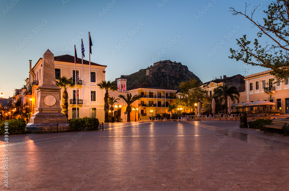 The historic square of the city of Nafplio located in the old town.The castle of Palamidi in the background.