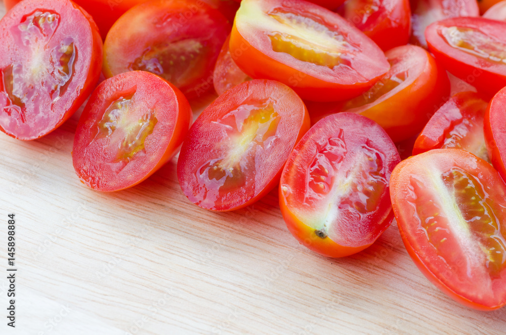 cherry tomatoes on wooden cutting board cherry tomatoes on wooden cutting board