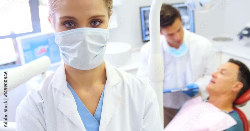 Portrait of dentist standing with arms crossed Portrait of dentist standing with arms crossed