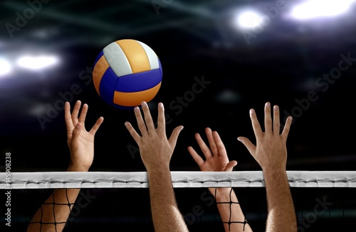 Volleyball spike hand block over the net