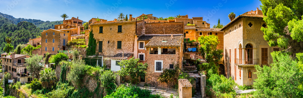 Panorama view of the old historic mountain village Deia on Majorca at Serra de Tramuntana Spain Panorama view of the old historic mountain village Deia on Majorca at Serra de Tramuntana Spain