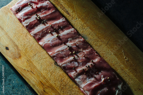 Raw pork ribs, on wooden board photo