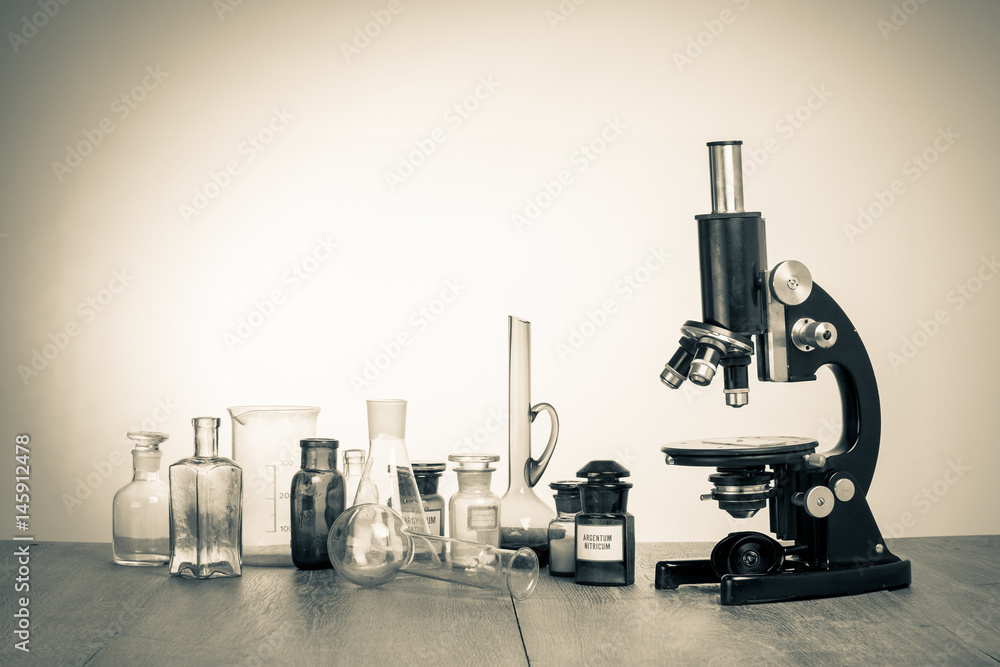 Old laboratory glass and retro microscope vintage sepia photo Stock Photo |  Adobe Stock