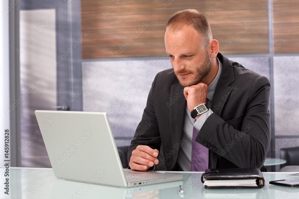Businessman working with laptop computer Businessman working with laptop computer