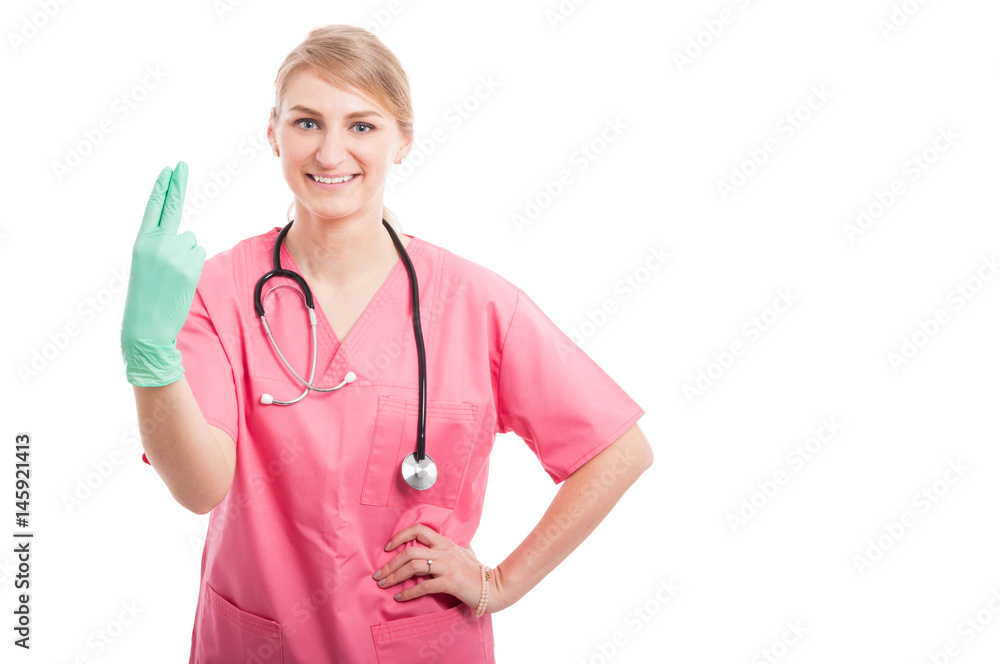 Female proctologist posing showing fingers and smiling Female proctologist posing showing fingers and smiling