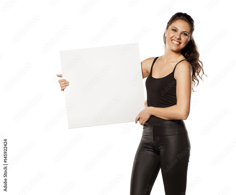 young beautiful brunette holding a blank board for advertisement young beautiful brunette holding a blank board for advertisement