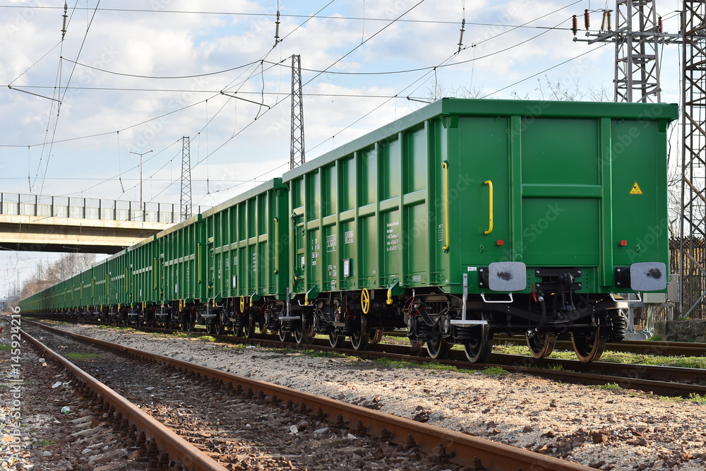 Burgas, Bulgaria - March 20, 2017 - Freight cargo train - 4axled box wagon green Type:Eanos Model:155-1 - Transvagon AD Burgas, Bulgaria - March 20, 2017 - Freight cargo train - 4axled box wagon green Type:Eanos Model:155-1 - Transvagon AD