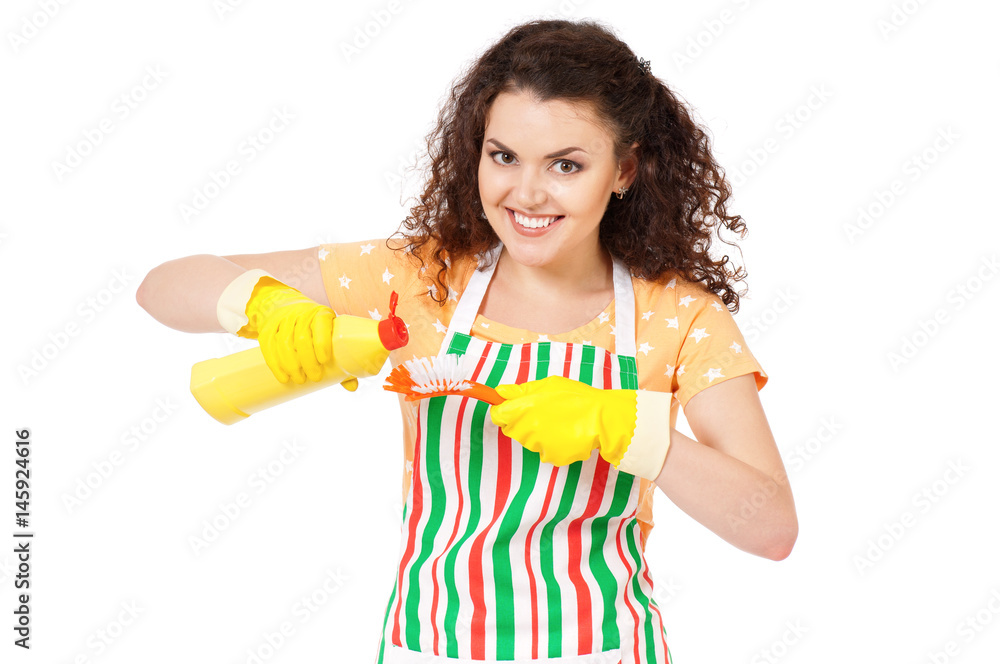 Smiling young woman holding bottle of chemistry for cleaning house. Cleaning concept. Beautiful happy girl with cleaning tools and products on white background. Housekeeper isolated portrait. Smiling young woman holding bottle of chemistry for cleaning house. Cleaning concept. Beautiful happy girl with cleaning tools and products on white background. Housekeeper isolated portrait.
