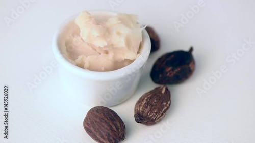 close up of shea butter nuts on rotating table