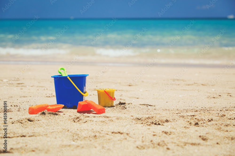 kid toys on tropical sand beach kid toys on tropical sand beach