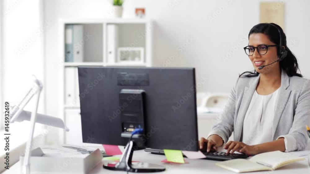 businesswoman with headset and computer at office businesswoman with headset and computer at office