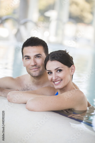 Young couple relaxing in thalassotherapy thermal water