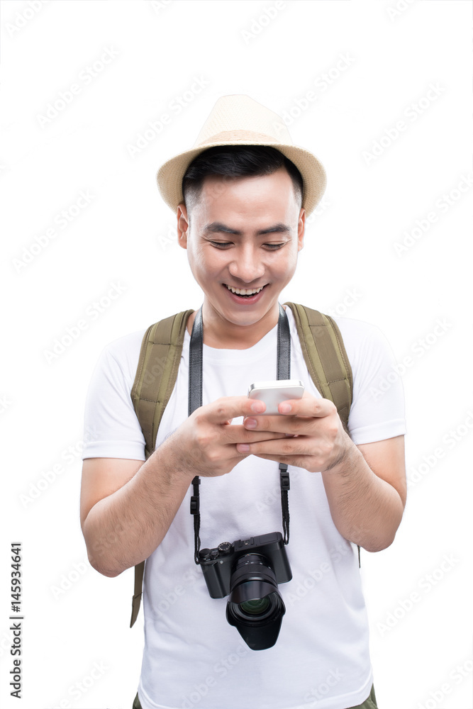 Travel concept. Studio portrait of handsome young man in hat with backpack. Isolated on white. Travel concept. Studio portrait of handsome young man in hat with backpack. Isolated on white.