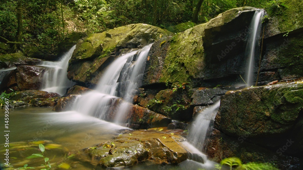 Beautiful waterfall landscape in a rainforest jungle Beautiful waterfall landscape in a rainforest jungle