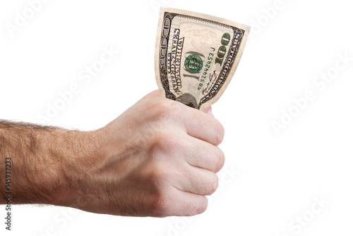 man's hand squeezes a hundred dollar bill