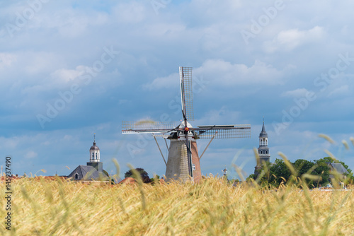 wheat field with windmill photo