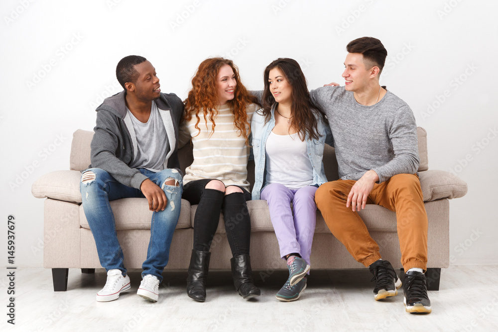 Party with friends, young people sitting on couch Stock Photo | Adobe Stock