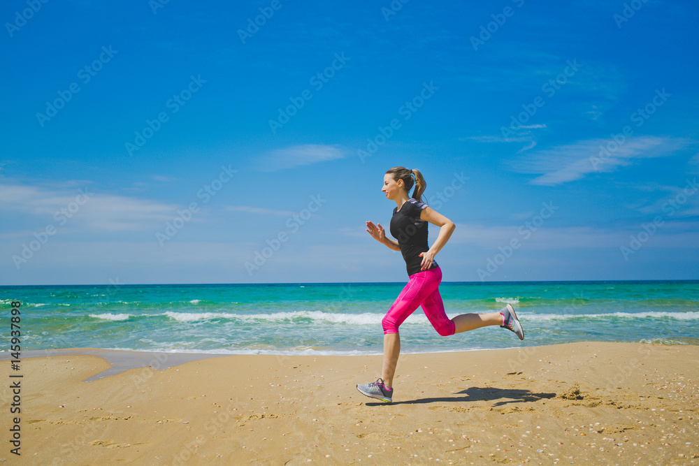 Beautiful sport woman running on the beach healthy lifestyle Beautiful sport woman running on the beach healthy lifestyle