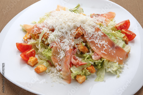 Ham and parmesan salad with tomatoes and croutons