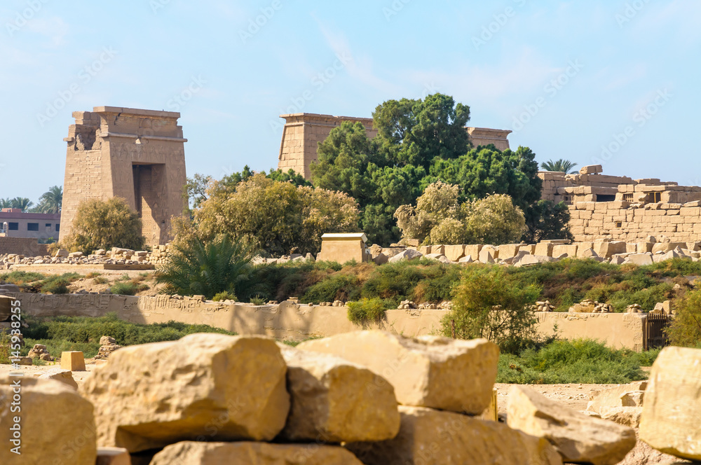 A view of the Karnak temple in Luxor, Egypt. The East Gate Of Nectanebo appears in the background