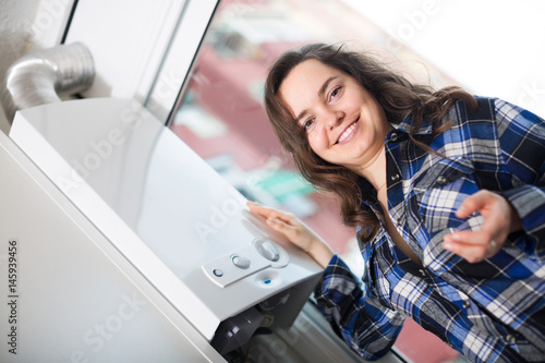 Girl using heating water system © JackF