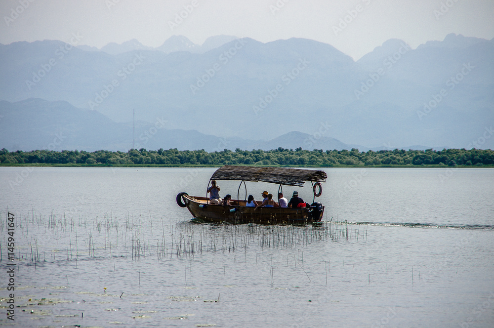 Boat with tourists on Lake Skadar