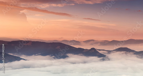 Mountain panorama during sundown. Beautiful natural panoramic landscape in the summer time..