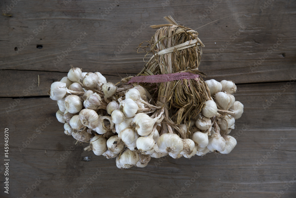 Raw garlic on wood table for cooking Raw garlic on wood table for cooking