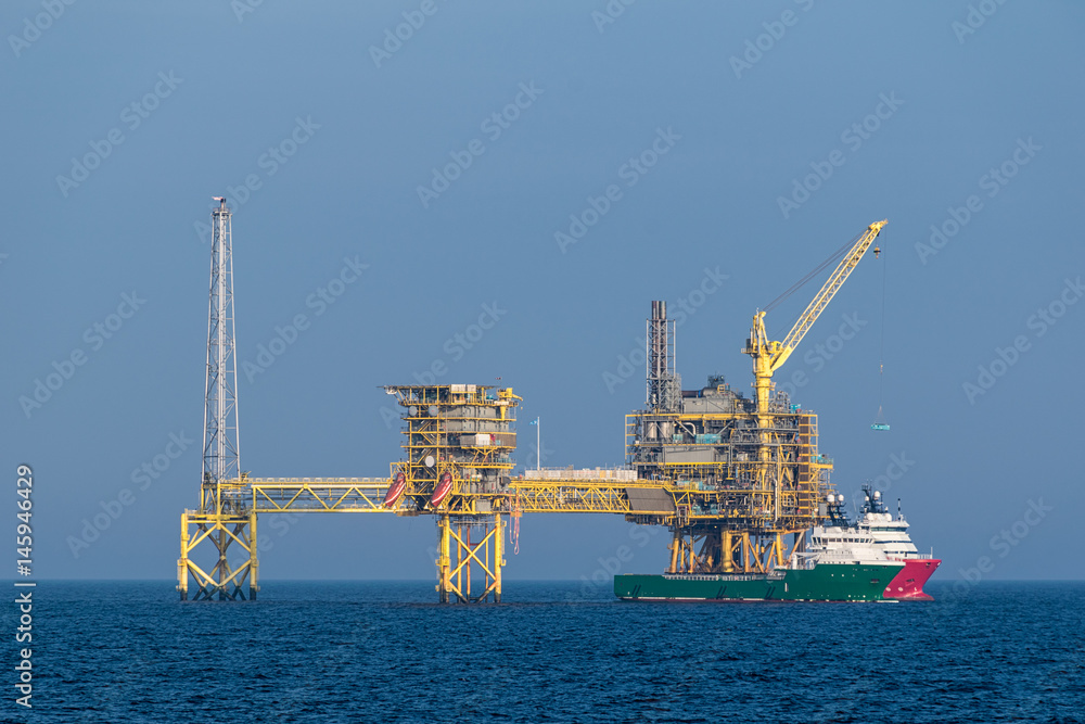 Supply of an oil rig at sea.