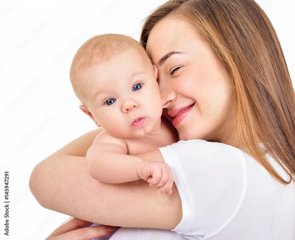 Mother and baby playing and smiling. Happy family.