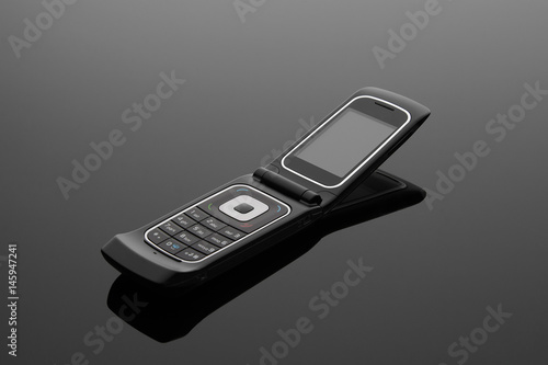 The old mobile phone on a grey background.